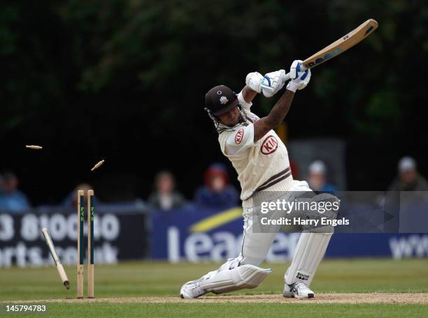 Jade Dernbach of Surrey is bowled during the LV County Championship Division One match between Sussex and Surrey at Horsham on June 6, 2012 in...