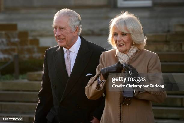 King Charles III and Camilla, Queen Consort leave Bolton Town Hall during a tour of Greater Manchester on January 20, 2023 in Bolton, United Kingdom.