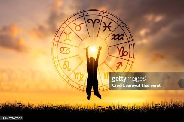zodiac signs inside of horoscope circle. astrology in the sky with many stars and moons  astrology and horoscopes concept - sternzeichen stock-fotos und bilder