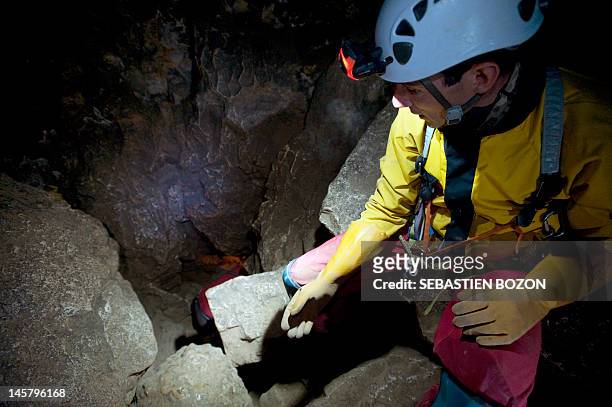 Speleologist of the Doubs Departmental Committee visits the cave of Osselle, eastern France, on June 5, 2012. Discovered in the 13th century,...