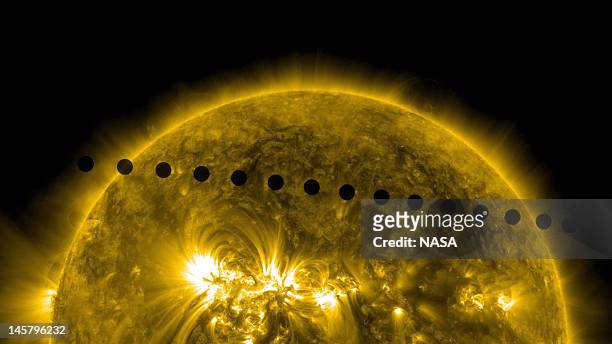 In this handout composite image provided by NASA, the SDO satellite captures the path sequence of the transit of Venus across the face of the sun at...
