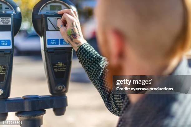 adult male in wheelchair using parking meter on small town western usa city street in autumn photo series - happiness meter stock pictures, royalty-free photos & images