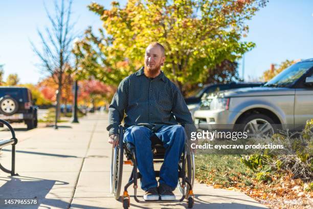 adult male in wheelchair on small town western usa city street in autumn photo series - roll call stock pictures, royalty-free photos & images