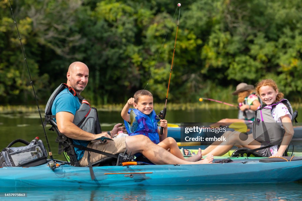 Boy Holding Up Bluegill Sunfish He Just Caught Kayak Fishing