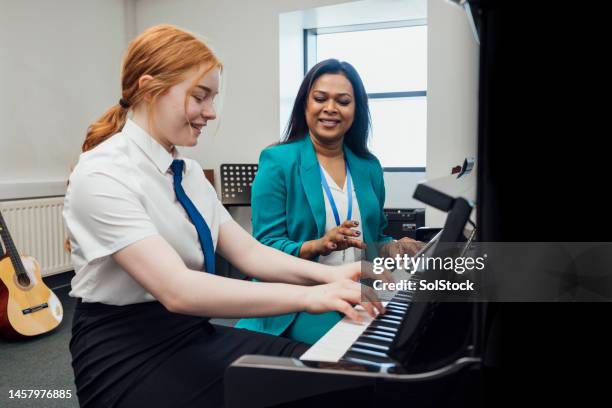 piano lessons at school - adult classroom stock pictures, royalty-free photos & images