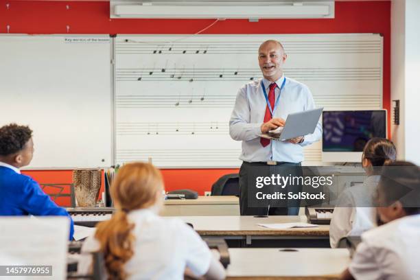 happy to be teaching the class - musical instrument stock pictures, royalty-free photos & images