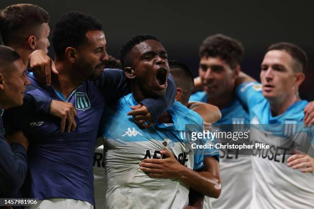 Johan Carbonero of Racing Club celebrates with teammates after scoring the team's first goal during the Supercopa Argentina Final match between Boca...