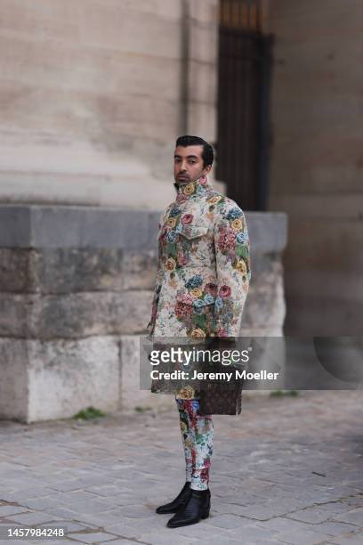 Abdulla Al Abdulla seen wearing a colorful Louis Vuitton Look, blazer, shorts and pants, black boots and a Louis Vuitton brown handbag outside the...