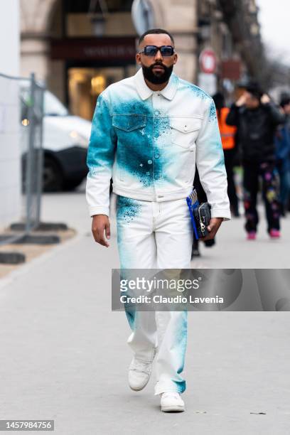 Jean-Claude Mpassy wears turquoise and white Louis Vuitton denim jacket with matching pants, outside Louis Vuitton, during Paris Fashion Week -...