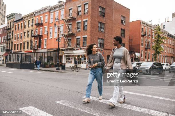 friends walking in the west village, ny - west village stock pictures, royalty-free photos & images