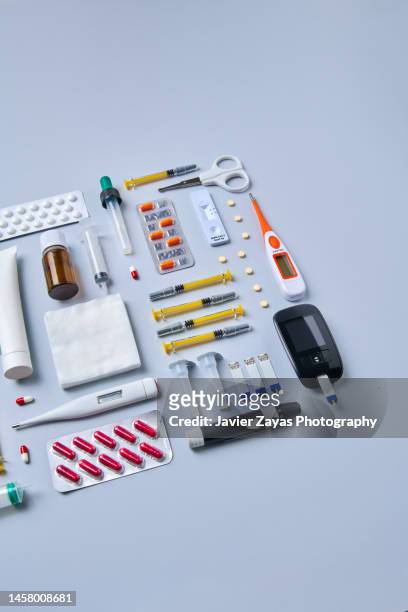 medical supplies on gray colored background - needle injury stock pictures, royalty-free photos & images