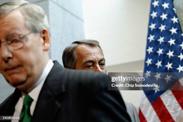 Senate Minority Leader Mitch McConnell leaves during a brief press conference with Speaker of the House John Boehner after the weekly House GOP...