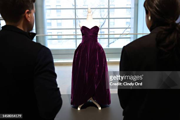 People look at Princess Diana's ball dress by Victor Edelstein during The One press preview at Sotheby's New York on January 20, 2023 in New York.