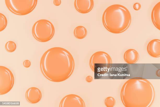 drops of foundation for skin on pastel background. beautiful delicate beige smear of bb face cream. products for makeup and skin care. skin tone. 3d pattern. - huidkleurig stockfoto's en -beelden