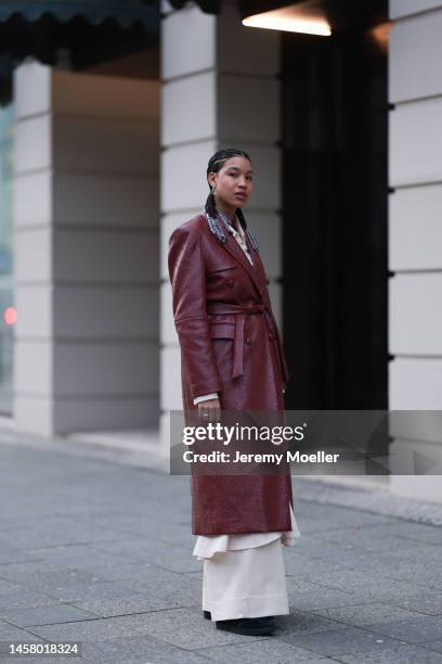 Shaquille Shaniqua Joy seen wearing black Adidas gazelle sneaker, red long leather coat, beige blouse, beige wide trousers before the William Fan...