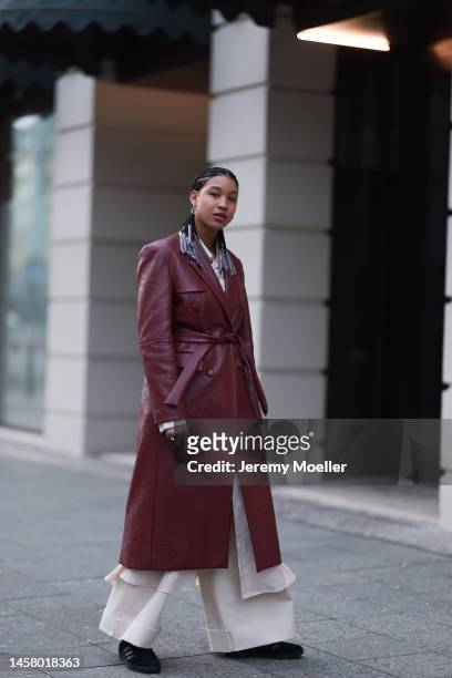 Shaquille Shaniqua Joy seen wearing black Adidas gazelle sneaker, red long leather coat, beige blouse, beige wide trousers before the William Fan...