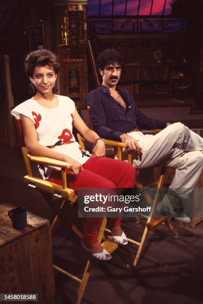 American actress and singer Moon Unit Zappa and her father, musician Frank Zappa sit in director's chairs during an interview on MTV at Teletronic...