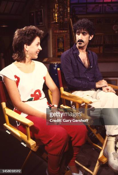 American actress and singer Moon Unit Zappa and her father, musician Frank Zappa sit in director's chairs during an interview on MTV at Teletronic...