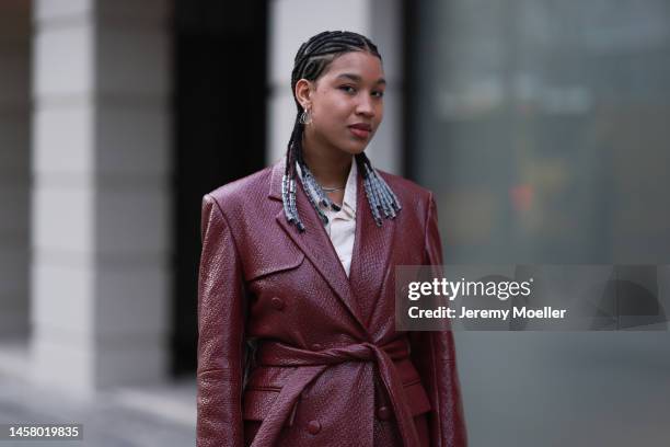 Shaquille Shaniqua Joy seen wearing black Adidas gazelle sneaker, red long leather coat, beige blouse, beige wide trousers before the William Fan...