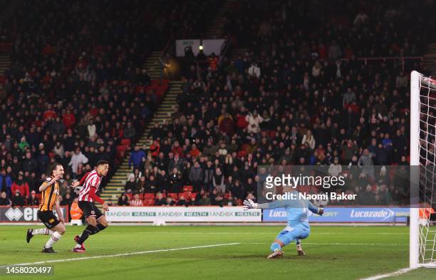 Daniel Jebbison of Sheffield United scores the team's first goal during the Sky Bet Championship match between Sheffield United and Hull City at...