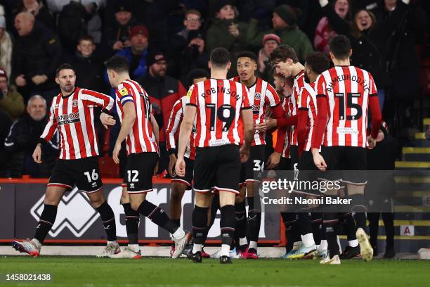 Daniel Jebbison of Sheffield United celebrates with teammates after scoring the team's first goal during the Sky Bet Championship match between...