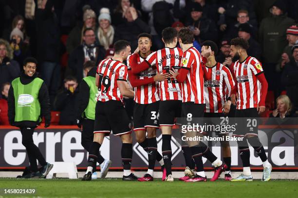 Daniel Jebbison of Sheffield United celebrates with teammates after scoring the team's first goal during the Sky Bet Championship match between...