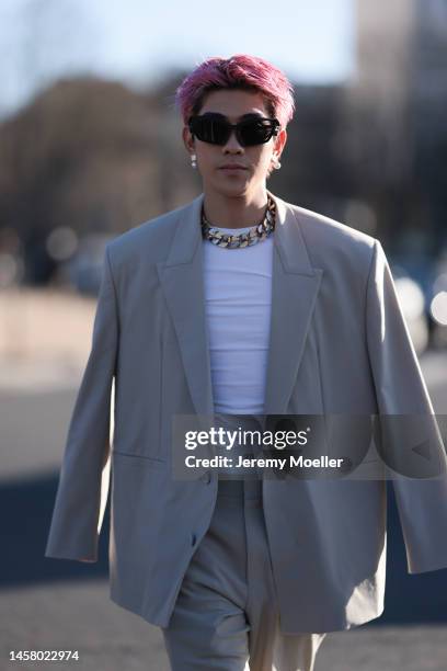 Maito Raul Murakami seen wearing a beige oversized suit, white shirt, black shades and black shoes before the Givenchy show during the Paris Fashion...