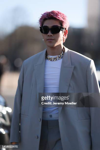 Maito Raul Murakami seen wearing a beige oversized suit, white shirt, black shades and black shoes before the Givenchy show during the Paris Fashion...