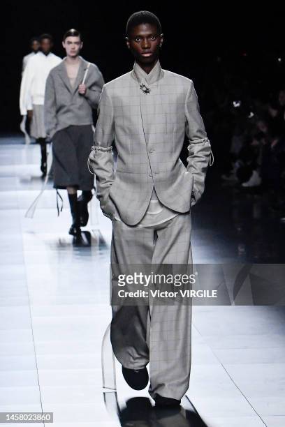 Model walks the runway during the Dior Homme Ready to Wear Fall/Winter 2023-2024 fashion show as part of the Paris Men Fashion Week on January 20,...
