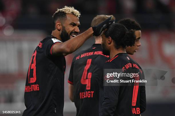 Eric Maxim Choupo-Moting of Bayern Munich celebrates with teammate Serge Gnabry after scoring the team's first goal during the Bundesliga match...