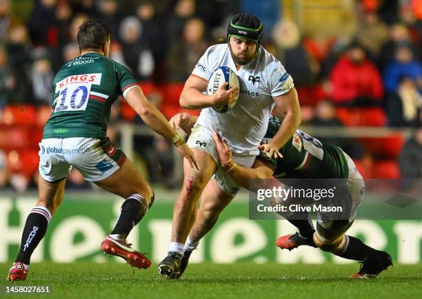 Nicky Smith of Ospreys is tackled by Olly Cracknell and Handre Pollard of Leicester Tigers during the Heineken Champions Cup Pool B match between...