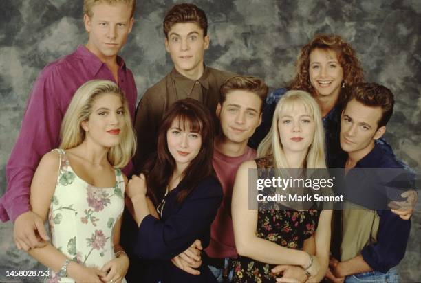 The Beverly Hills, 90210 cast poses for a portrait on set, September 1991 in Los Angeles, California. Left to right: Ian Ziering, Tori Spelling,...