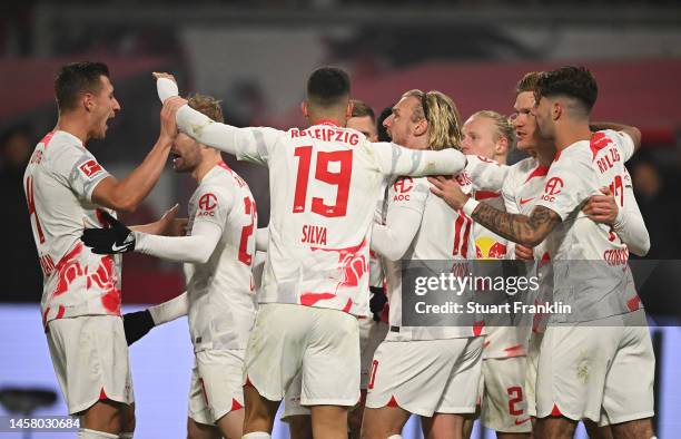 Marcel Halstenberg of RB Leipzig celebrates with teammates after scoring the team's first goal during the Bundesliga match between RB Leipzig and FC...