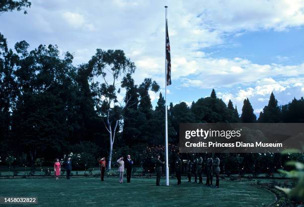 General view of a flag presentation, part of the county's formal independence ceremony, Harare, Zimbabwe, April 18, 1980. Among those visible are,...