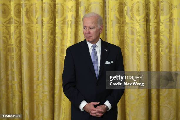 President Joe Biden listens as he hosts mayors from across the country during an event at the East Room of the White House on January 20, 2023 in...