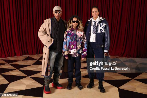 Pharrell Williams, Rocket Ayer Williams and Helen Lasichanh attend the Kenzo Menswear Fall-Winter 2023-2024 show as part of Paris Fashion Week on...