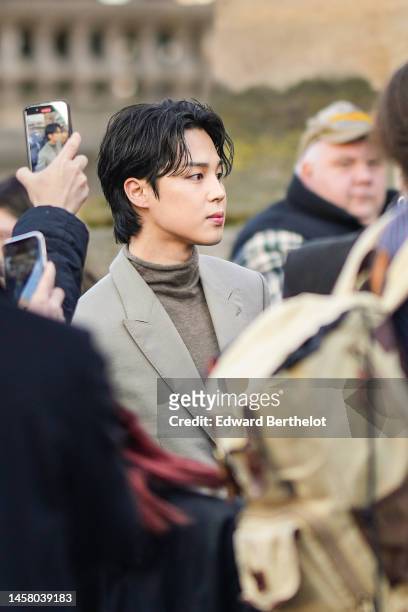 Jimin of BTS is seen outside Dior, during the Paris Fashion Week - Menswear Fall Winter 2023 2024 : Day Four on January 20, 2023 in Paris, France.