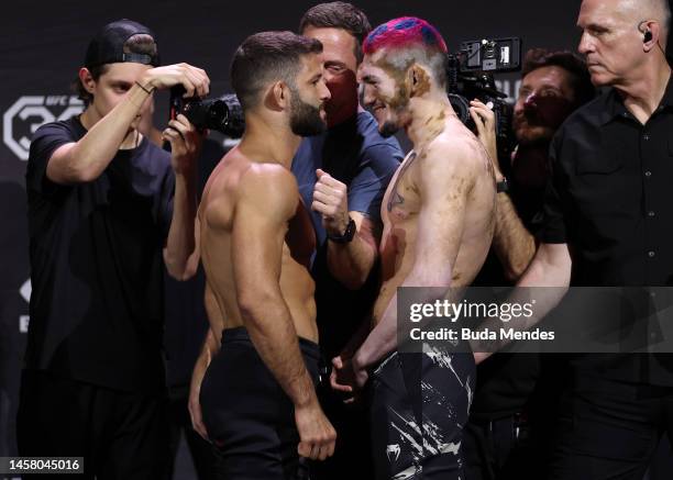 Opponents Thiago Moises of Brazil and Melquizael Costa of Brazil face off during the UFC 283 weigh-in at Jeunesse Arena on January 20, 2023 in Rio de...