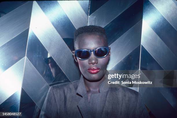 Jamaican-born singer and model Grace Jones poses in front of a reflective backdrop at Bonds Disco, New York, New York, June 9, 1980.