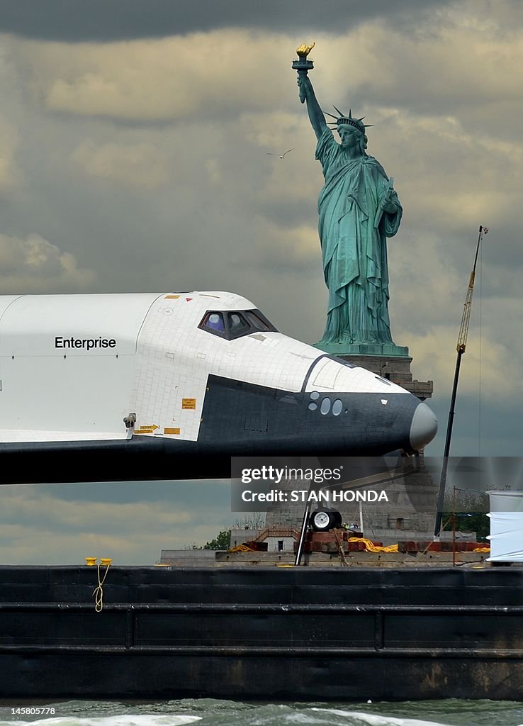 The space shuttle Enterprise is towed by