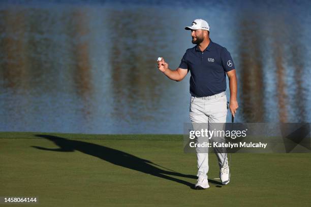 Jon Rahm of Spain waves as he walks off the ninth green during the second round of The American Express at PGA West Nicklaus Tournament Course on...