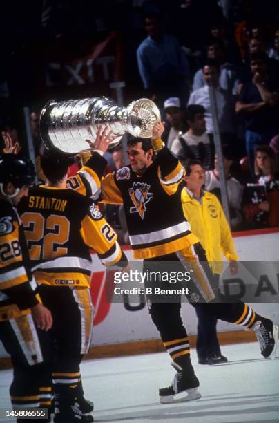Ron Francis of the Pittsburgh Penguins skates on the ice with the Stanley Cup after Game 4 of the 1992 Stanley Cup Finals against the Chicago...