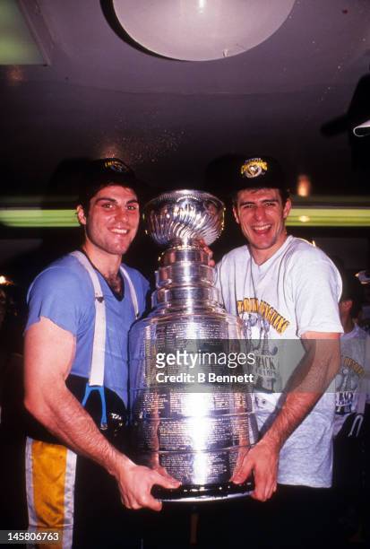Rick Tocchet and Ron Francis of the Pittsburgh Penguins celebrate in the locker room with the Stanley Cup after Game 4 of the 1992 Stanley Cup Finals...