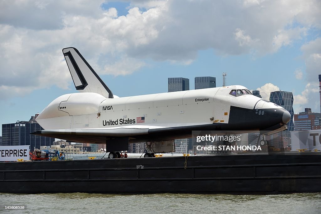 The space shuttle Enterprise is towed by