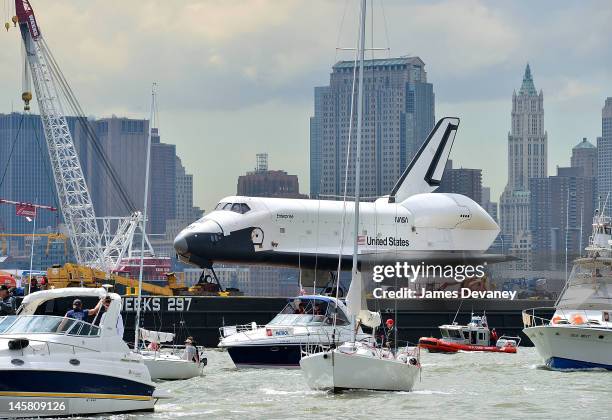 Space Shuttle Enterprise is transported to the Intrepid Sea, Air & Space Museum on June 6, 2012 in New York City.