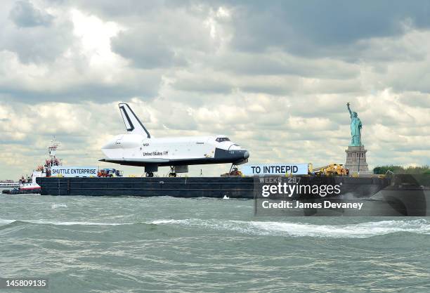 Space Shuttle Enterprise is transported to the Intrepid Sea, Air & Space Museum on June 6, 2012 in New York City.