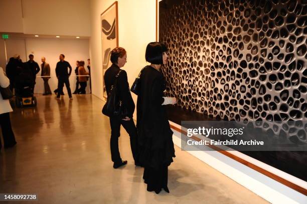 Guests attend the Andreas Gursky Exhibit at the Gagosian Gallery.
