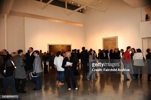 Guests attend the Andreas Gursky Exhibit at the Gagosian Gallery.