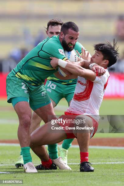 Mark Roche of Ireland is tackled during the 2023 HSBC Sevens match between Ireland and Japan at FMG Stadium on January 21, 2023 in Hamilton, New...