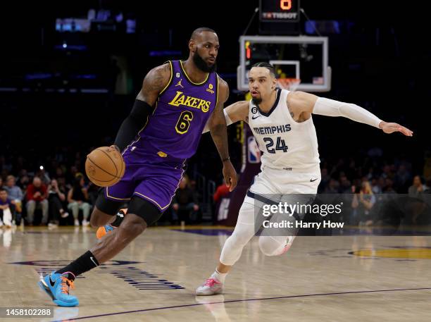 LeBron James of the Los Angeles Lakers drives to the basket on Dillon Brooks of the Memphis Grizzlies during the first half at Crypto.com Arena on...